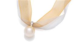 Sale 9473 - Lot 375 - A 9CT WHITE GOLD SOUTH SEA CHAMPAGNE PEARL ENHANCER PENDANT; 12.7mm cultured pearl of good champagne colour and lustre, pendant leng...